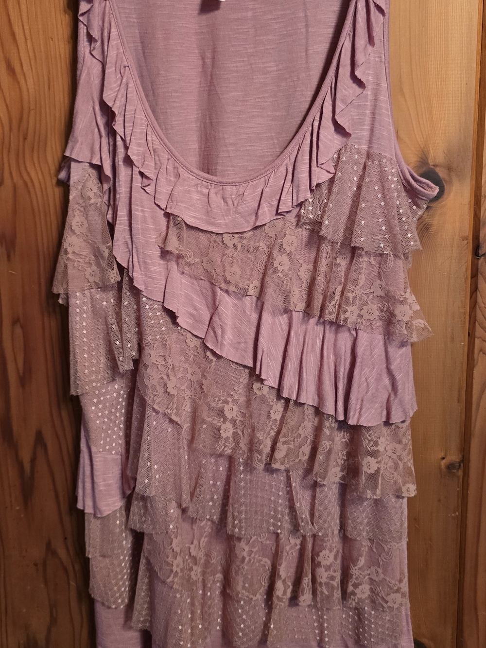 Eyelash Couture top features a dusty pink color with asymmetrical ruffled layers